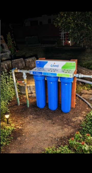 KIND whole-house water filtration system installed outdoors