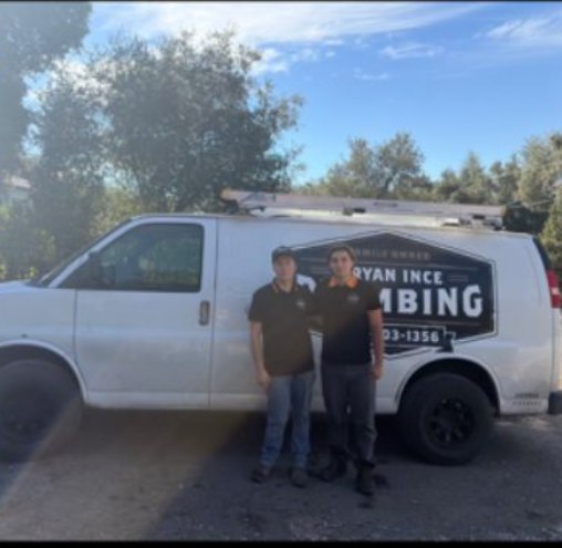 Bryan Ince Plumbing team standing in front of their service van
